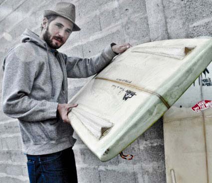 Spoe with one of his shaped surfboard