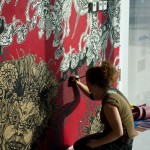 Portrait of the street artist Swoon in action