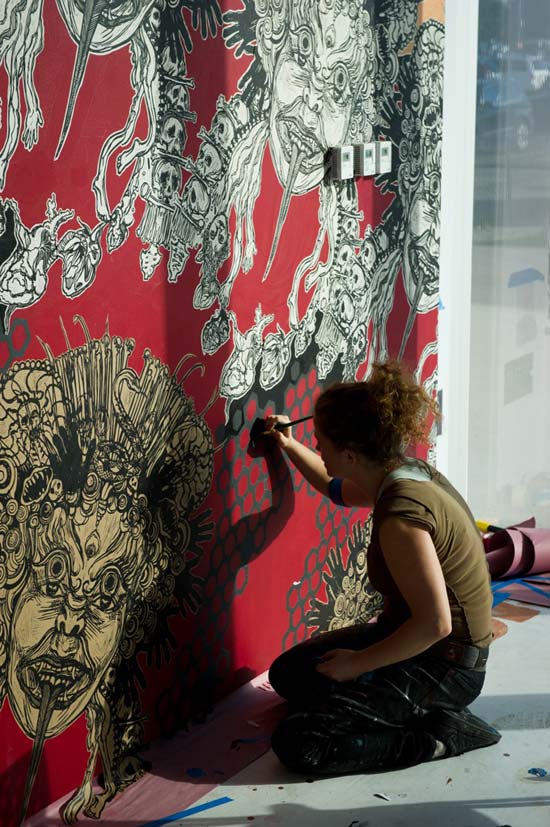 Portrait of the street artist Swoon in action